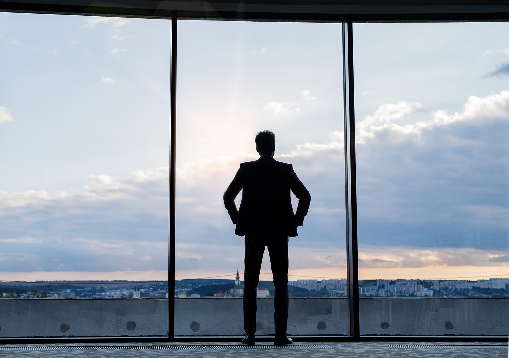Businessman standing at window